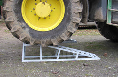 Loading ramp being used with big tractor 