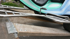 TRIKE DIAMOND PLATE ALUMINUM LOADING RAMP KIT  being used on a vehicle, driving the trike up