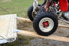 aluminum loading ramp kit being used on a trailer with a 4 wheeler